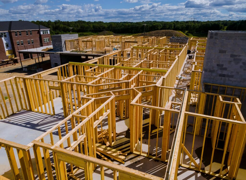 New construction home residential construction home framing against a blue sky